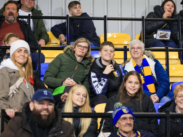 Travelling Mansfield Town fans during the Sky Bet League One match against AFC Wimbledon at Stadium Plough Lane.