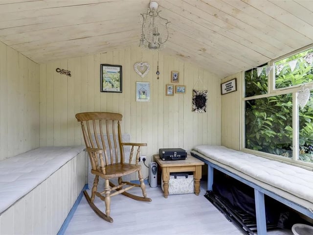 The summer house leads to several upper garden patios for relaxing and entertaining.