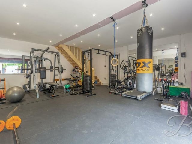Part of the garage is occupied at present by this well-equipped gym.