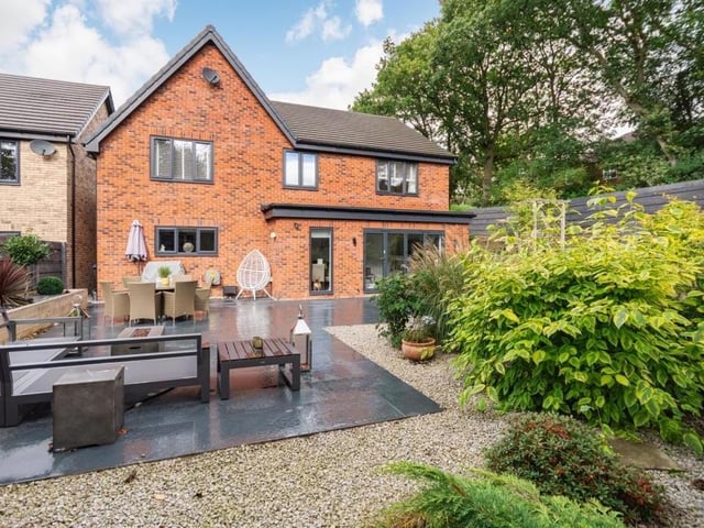 An overview of the landscaped back garden, showing how the rear of the property looks.