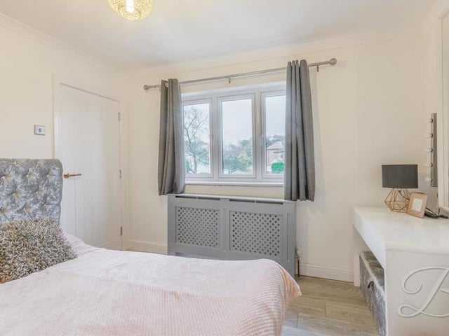 A third well-presented bedroom, with space for a dressing table or desk.