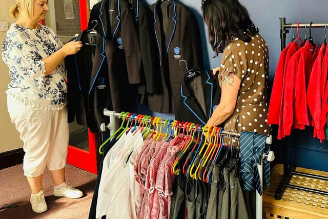 Nadine McGuiness and Karen Bonsall, volunteers, pictured sorting out Meden School blazers.