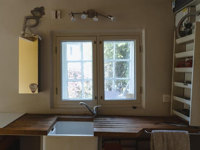 The cottage in the garden of the property provides full living accommodation, including this kitchenette. Also on the ground floor is a sitting room, with modern wood-burner, and WC.