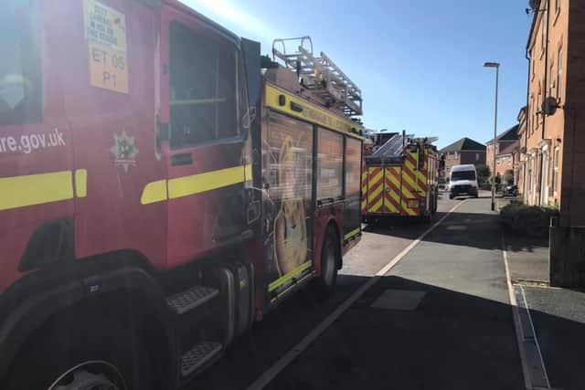 Firefighters attend the scene of a tumble drier fire at Kirkby