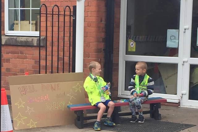 Best friends AJ Coleman (left) and William Burton (right) relaxing after completing their running and cycling challenge yesterday.