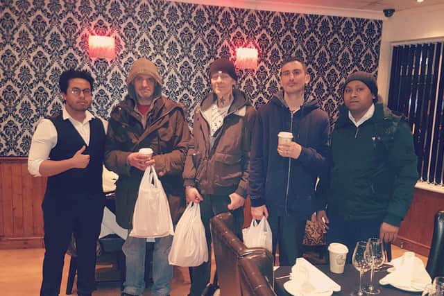 Staff members Nahid and Raihan pictured with some of their customers.