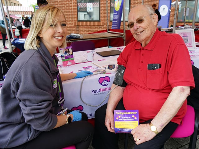Harriett Renolds registered care manager at Your Home care checking Trevor Clowers' blood pressure.