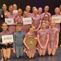 The 2023 winners, Divinity, an Excelsior Dance Troupe (aged eight to 18), pictured with the presenters, Paul Bacon, and Katie Trinder from Mansfield 103.2, and the President of Mansfield Rotary, Karen Johnson.