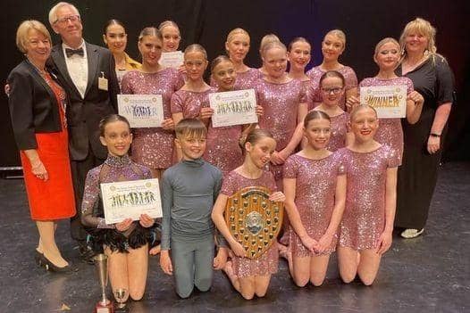 The 2023 winners, Divinity, an Excelsior Dance Troupe (aged eight to 18), pictured with the presenters, Paul Bacon, and Katie Trinder from Mansfield 103.2, and the President of Mansfield Rotary, Karen Johnson.