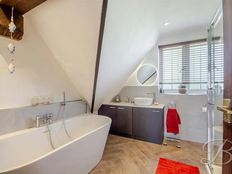 A four-piece suite comprising a bath, separate shower, low-flush WC, and hand wash basin. You will also find a handy electric towel rail The room is designed for both functionality and comfort.