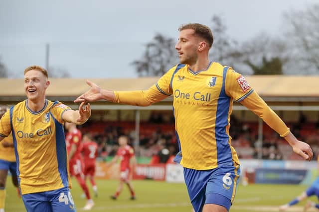Bailey Cargill celebrates during the Sky Bet League 2 match against Crawley Town FC at The Broadfield Stadium, Saturday 16 December2023 
Photo credit -  Chris & Jeanette Holloway / The Bigger Picture.media