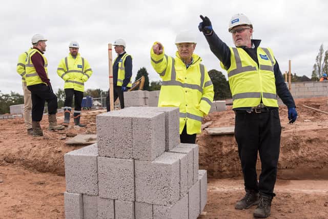 Men at work on the site of the Sherwood Oak Homes development at Clisptone, near Mansfield.