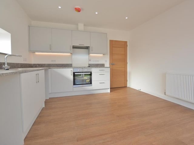 A final shot of the kitchen/diner, which is impressive in every way. Integrated appliances include an electric oven and a four-ring electric hob with extractor hood above. There is plumbing for a washing machine and space for a fridge freezer, not to mention ceiling spotlights, a smoke alarm and a TV point.