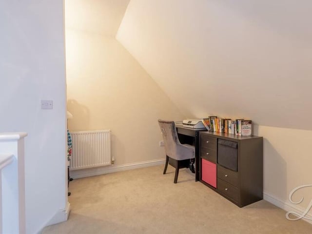 The landing on the first floor has space in a quiet corner for a desk and storage drawers.