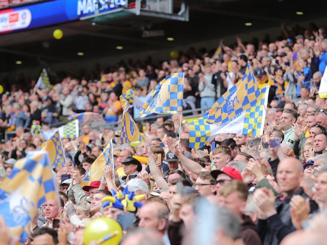 Mansfield Town fans watch the drama unfold inside Wembley.