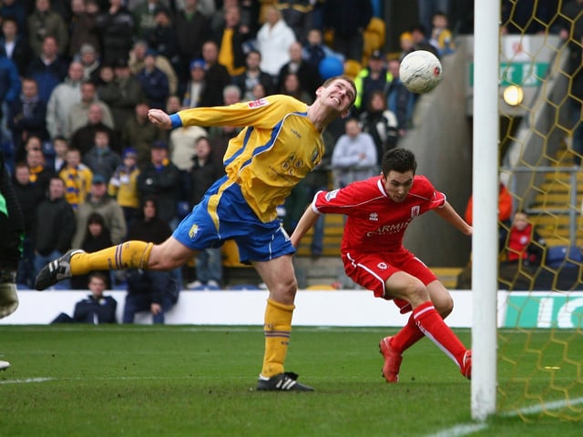 Jake Buxton heads the ball in to his own net under pressure from Stewart Downing as Middlesbrough knocked Stags out of the FA Cup on January 26, 2008.