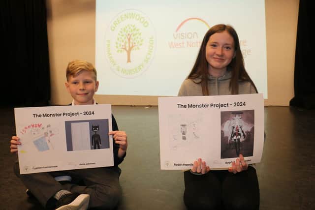 Cyprian Kusmierczak and Robyn Sylvie Hamilton with their monstrous creations