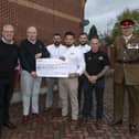 Andy Jones (second left) presents a cheque to the Royal British Legion in 2021 after an initiative to decorate the Ashfields estate in Sutton with poppies. Also in the photo are Andrew Brewster, boss of UPS, Lt Col Keith Spiers, who is to open Spectre Coffee, and MP Lee Anderson, a friend of Andy.