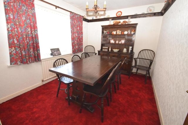 The second ground-floor bedroom is so flexible that it is currently being used as a dining room. You could use it to suit your own personal requirements. It is light and bright and decorated with a plate rack on the wall.