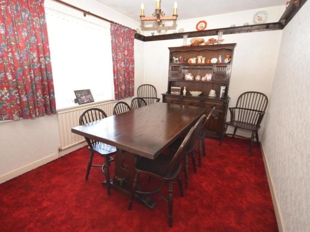The second ground-floor bedroom is so flexible that it is currently being used as a dining room. You could use it to suit your own personal requirements. It is light and bright and decorated with a plate rack on the wall.