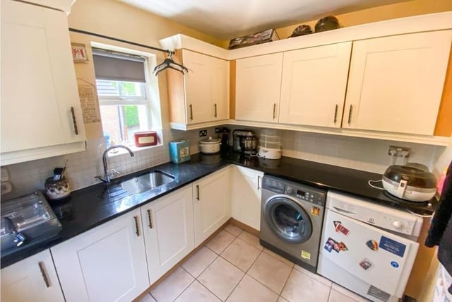 Off the kitchen is this utility room, complete with sink, fitted units, considerable storage units and space for a washing machine.