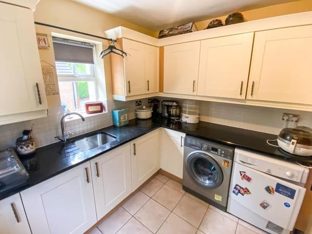 Off the kitchen is this utility room, complete with sink, fitted units, considerable storage units and space for a washing machine.