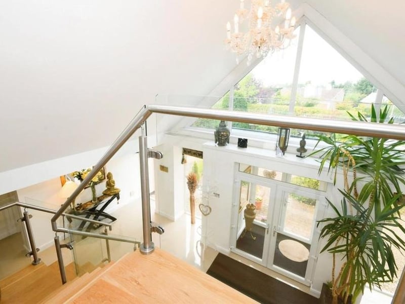 Time to move up to the first floor now, which means acquainting yourself with this rather unique landing and its view through the apex window above the front door of the property.