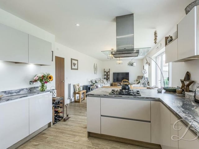 Separating the kitchen from the dining room and living space is a handy breakfast bar.