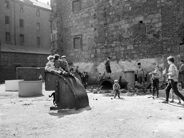 Glasgow - Children play in waste ground after removal of old property