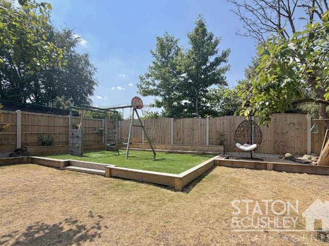 The landscaped rear garden is a low-maintenance outdoor space