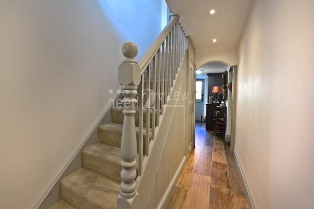 This spacious hallway gives a bright and welcoming entrance to Rose Cottage. In fact, it runs the whole length of the house, with ceiling spotlights, Karndean flooring and balustraded stairs to the first floor. There is also a storage cupboard underneath the stairs, plus an airing cupboard.