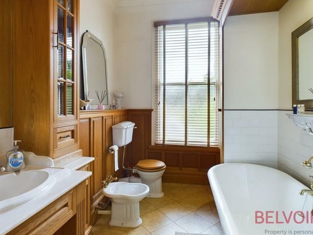 The first floor at Rydal House is completed by this fabulous five-piece bathroom suite, which is much bigger than it looks. It comprises a roll-top bath with mixer tap and shower head, a sink set in a vanity unit, a spacious shower cubicle with mains-fed shower, WC and bidet. Don't forget either the custom-made base and wall units with wood panelling and built-in lighting, a cast-iron radiator and Karndean flooring.