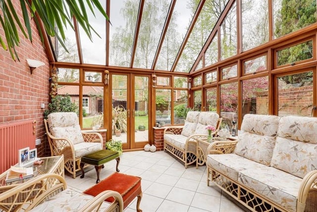 The appearance of the superb conservatory is in keeping with the rest of the property. It features tiled flooring, exposed-brick walls, a half-vaulted glass roof and double doors that open out on to the back garden.