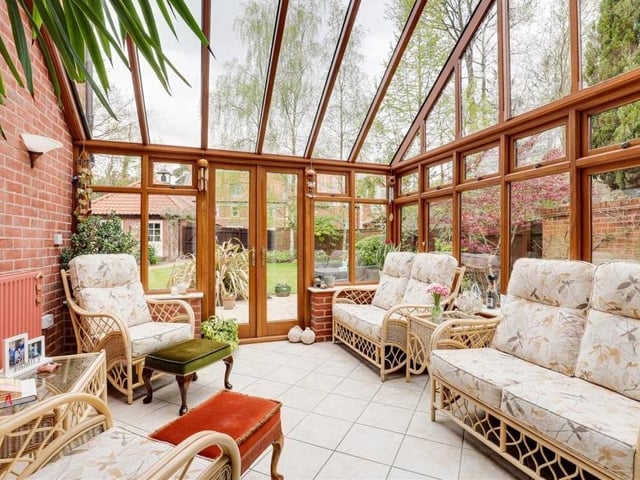 The appearance of the superb conservatory is in keeping with the rest of the property. It features tiled flooring, exposed-brick walls, a half-vaulted glass roof and double doors that open out on to the back garden.