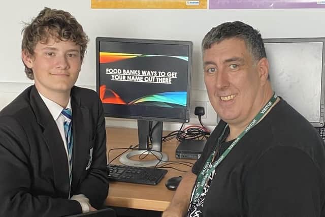 Shirebrook Academy student Thomas Brown is congratulated by David Spencer from Storehouse after he put together a presentation on how the organisation can use social media to spread the word.