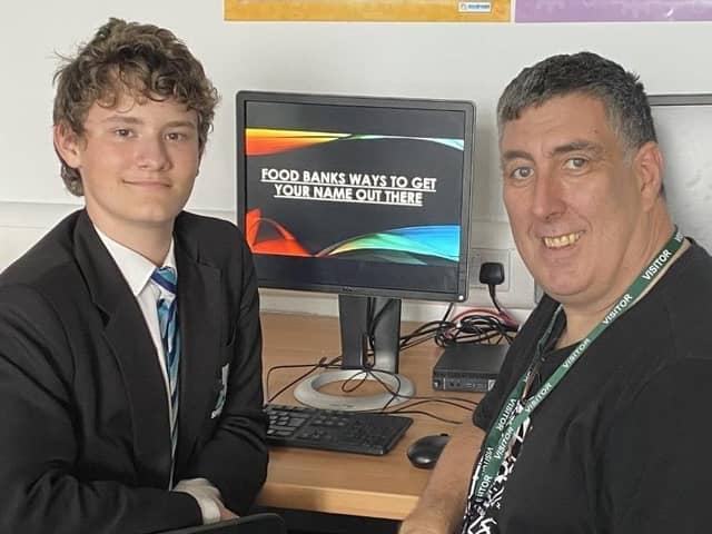Shirebrook Academy student Thomas Brown is congratulated by David Spencer from Storehouse after he put together a presentation on how the organisation can use social media to spread the word.