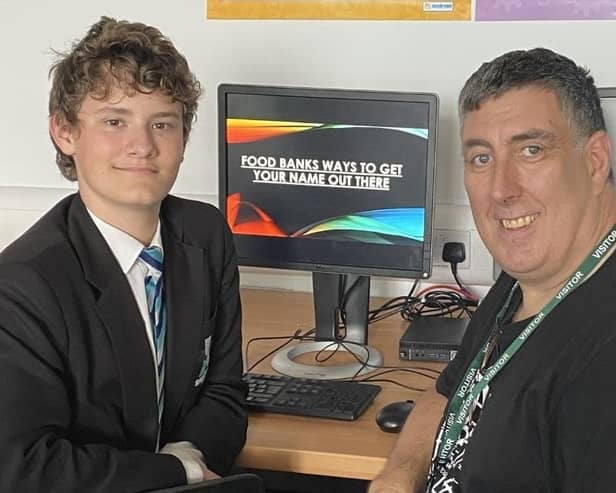 Shirebrook Academy student Thomas Brown is congratulated by David Spencer from Storehouse after he put together a presentation on how the organisation can use social media to spread the word.