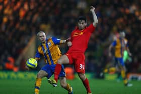 Lindon Meikle battles for the ball in the FA Cup third round tie against Liverpool in  2013.  (Photo by Clive Mason/Getty Images)