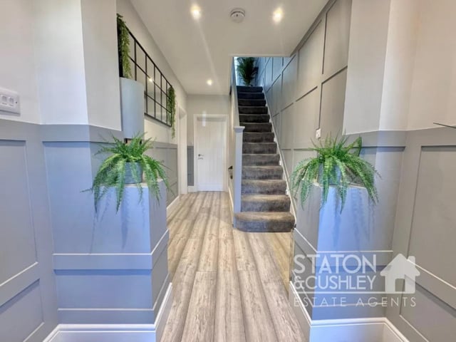 From the moment you step into the inviting hallway, you'll be struck by the sense of space and style that flows throughout.