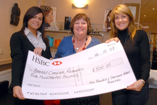Carole Ibbotson, Nottinghamshire manager for Cancer Research UK, receives a cheque for £500 raised during the year of office for Miss Mansfield and Sherwood Forest Dannyelle Charles, left. Also pictured is Trish Broadhead, promotions manager of Miss Mansfield and Sherwood Forest.