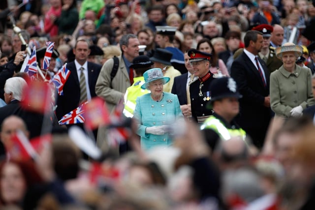 Queen Elizabeth II smiled as she greeted the crowds at Nottingham Town Hall during her visit to the East Midlands on June 13, 2012 in Nottingham, England. The Queen was accompanied by Prince William, Duke of Cambridge and Catherine, Duchess of Cambridge, during her official visit to the East Midlands. . (Photo by Christopher Furlong/Getty Images)
