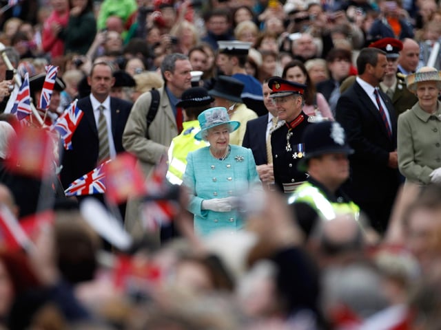Queen Elizabeth II smiled as she greeted the crowds at Nottingham Town Hall during her visit to the East Midlands on June 13, 2012 in Nottingham, England. The Queen was accompanied by Prince William, Duke of Cambridge and Catherine, Duchess of Cambridge, during her official visit to the East Midlands. . (Photo by Christopher Furlong/Getty Images)