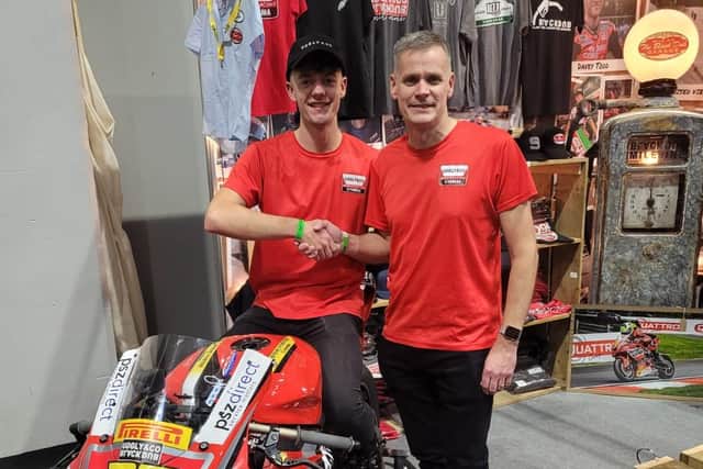 Max Cook is welcomed by team boss David Binch.