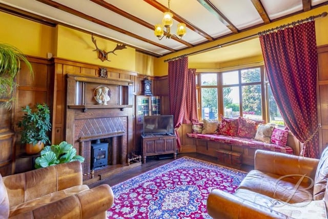 Warm and homely is the only way to describe the living room. It boasts solid oak flooring, a feature fireplace, traditional panelled walls and a bay window overlooking the front of the bungalow.