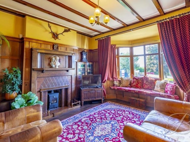 Warm and homely is the only way to describe the living room. It boasts solid oak flooring, a feature fireplace, traditional panelled walls and a bay window overlooking the front of the bungalow.