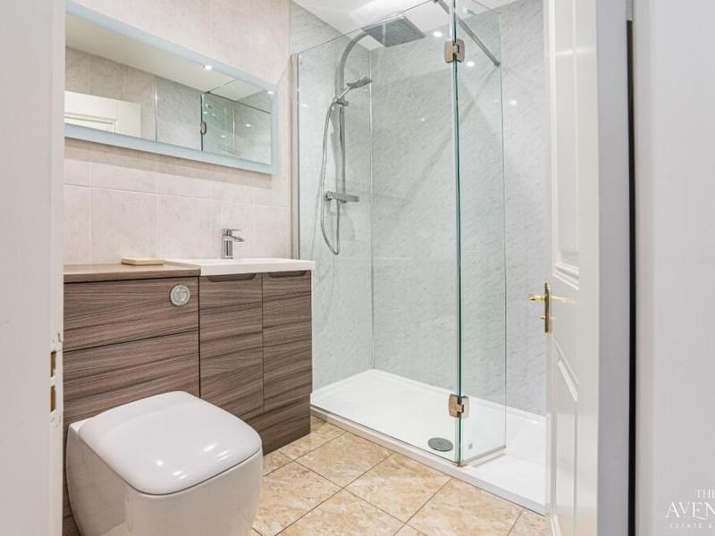 One of the en suite rooms on the first floor, complete with a walk-in shower.