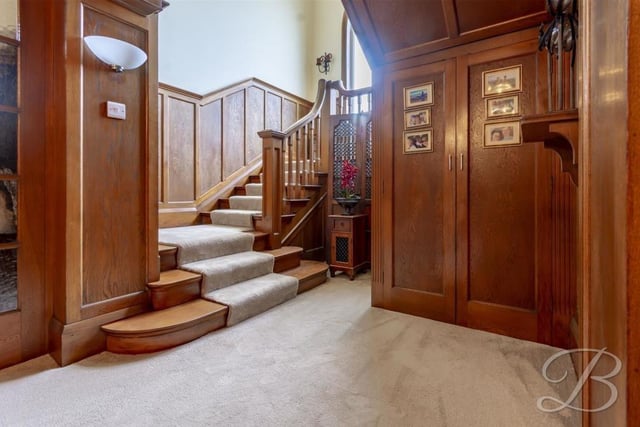 It's time to go the first floor now, via this stunning staircase that is lined with velvet and features a solid oak panelled wall.