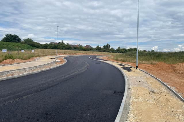 The new £3m one-kilometre spine road goes through the centre of the site, linking it to the Adamsway roundabout on the A6117.