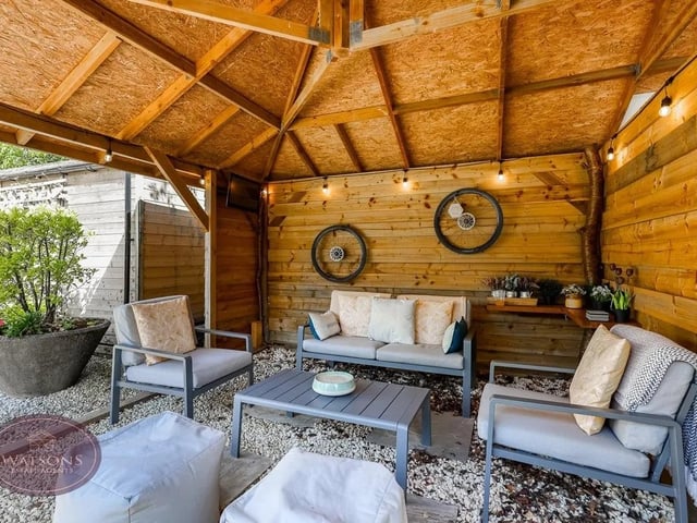 To the front of the property is a timber storage/seating area, perfect for alfresco entertaining