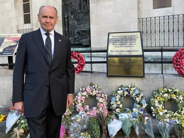 Sir John Peace, Lord-Lieutenant of Nottinghamshire, with some of the tributes laid to the Queen in the county.